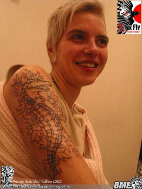 Poze Poze Tatuaje. Modele de Tatuaje (foto) - Dragon pe umar
